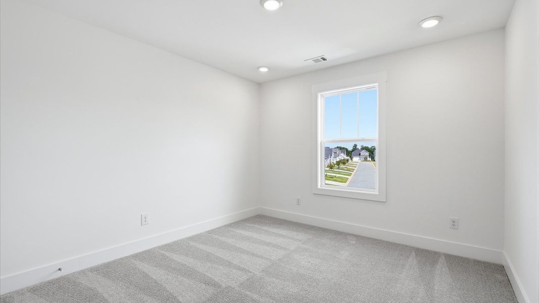First-class bedroom with generous proportions, a walk-in closet, and beautiful natural light through large windows