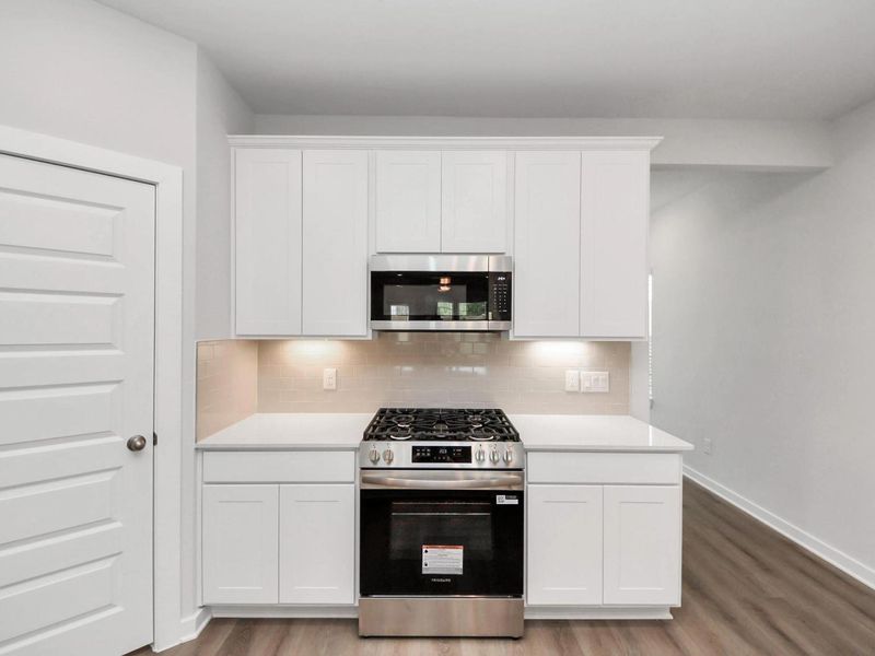 Furnished interior view inside a new home in Caney Creek Place, Conroe (Image 13).
