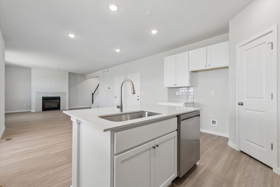 A kitchen with white cabinets. A kitchen with white cabinets.