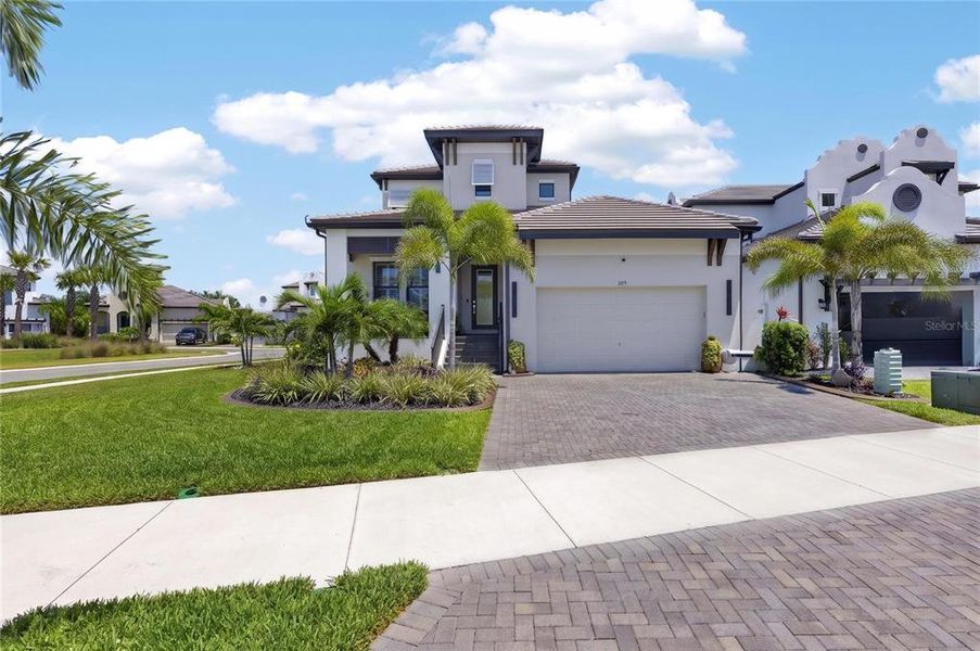 Front exterior of a new home in SouthShore Yacht Club, Ruskin, FL, highlighting curb appeal (Image 23).