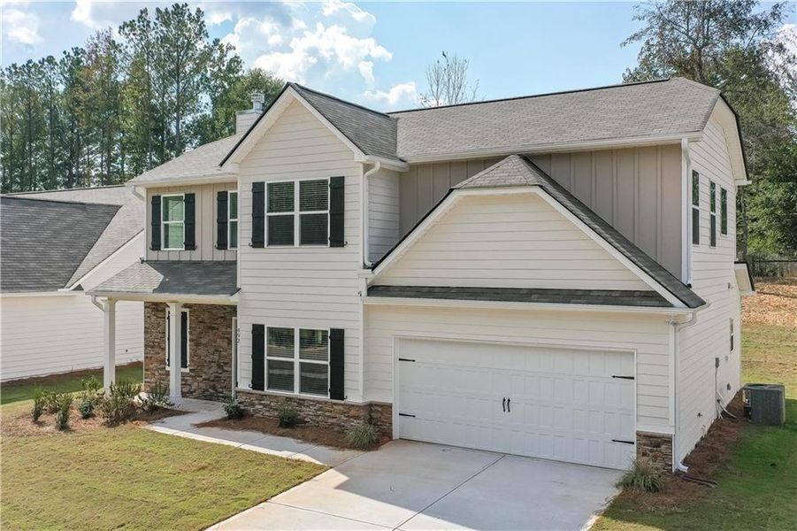 Front exterior of a new home in , Villa Rica, GA, highlighting curb appeal (Image 1).