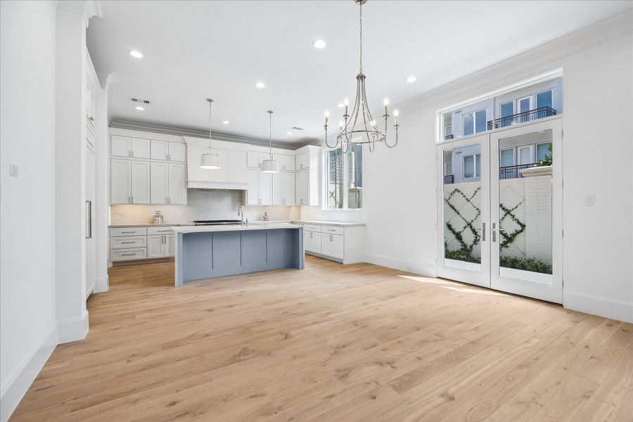 Off the dining are a set of French doors that lead to the beautifully landscaped backyard.