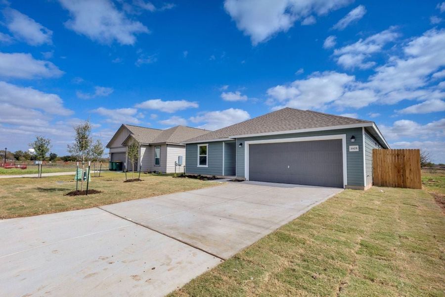 Front exterior of a new home in Hidden Trails, Belton, TX, highlighting curb appeal (Image 22).