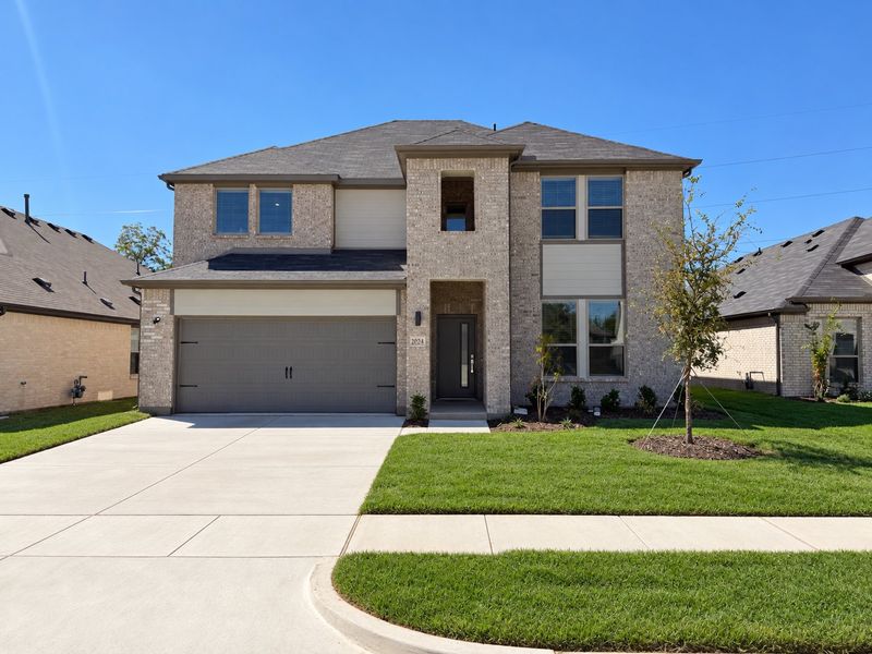 Front exterior of a new home in Stonehaven, Seagoville, TX, highlighting curb appeal (Image 1). Front exterior of a new home in Stonehaven, Seagoville, TX, highlighting curb appeal (Image 1).