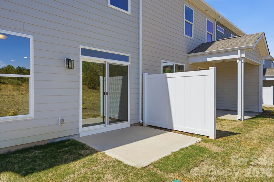 Exterior details and patio area of a home in Blythe Mill Townhomes, Waxhaw (Image 3).