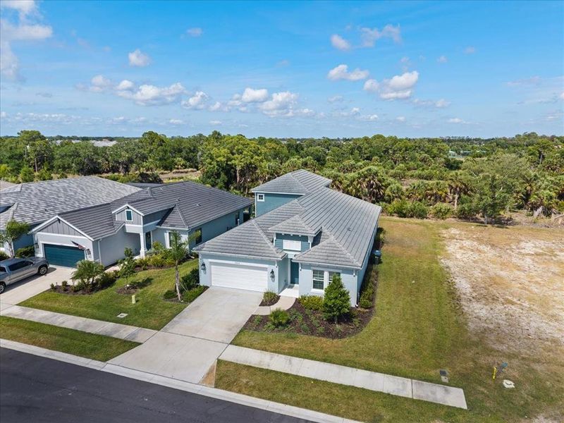 Front exterior of a new home in , Sarasota, FL, highlighting curb appeal (Image 24).