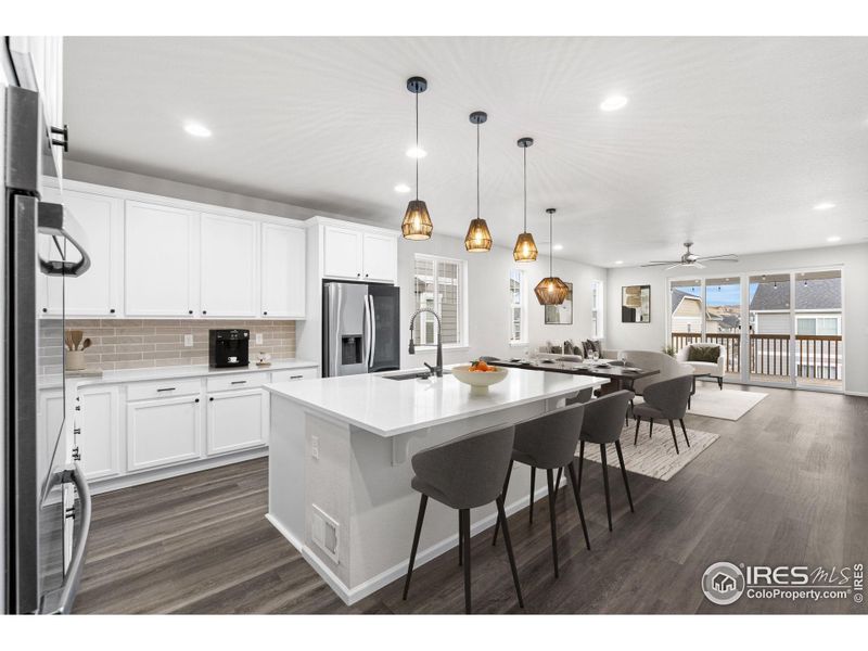 This photo has been virtually staged to provide visual ideas for how furniture can be arranged in this area of the home.