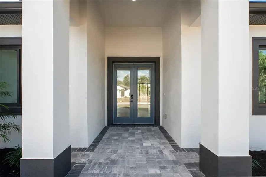 Exterior details and patio area of a home in , North Port (Image 26).