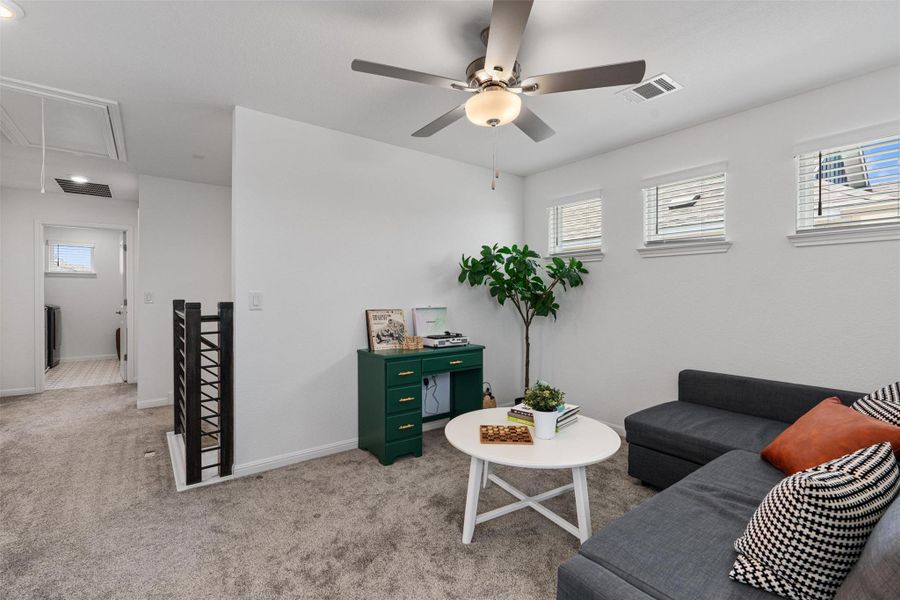 Upstairs loft with natural lighitng and celiing fan
