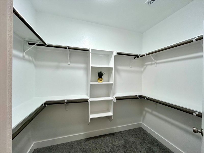 Primary bedroom walk-in closet.