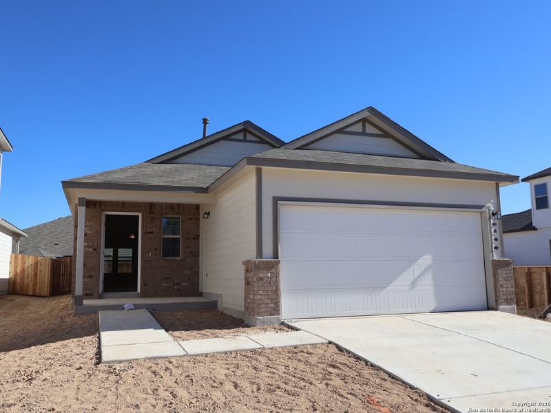 Front exterior of a new home in Winding Brook, San Antonio, TX, highlighting curb appeal (Image 19).