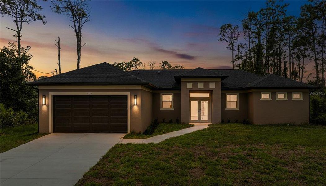 Front exterior of a new home in , North Port, FL, highlighting curb appeal (Image 2). Front exterior of a new home in , North Port, FL, highlighting curb appeal (Image 2).