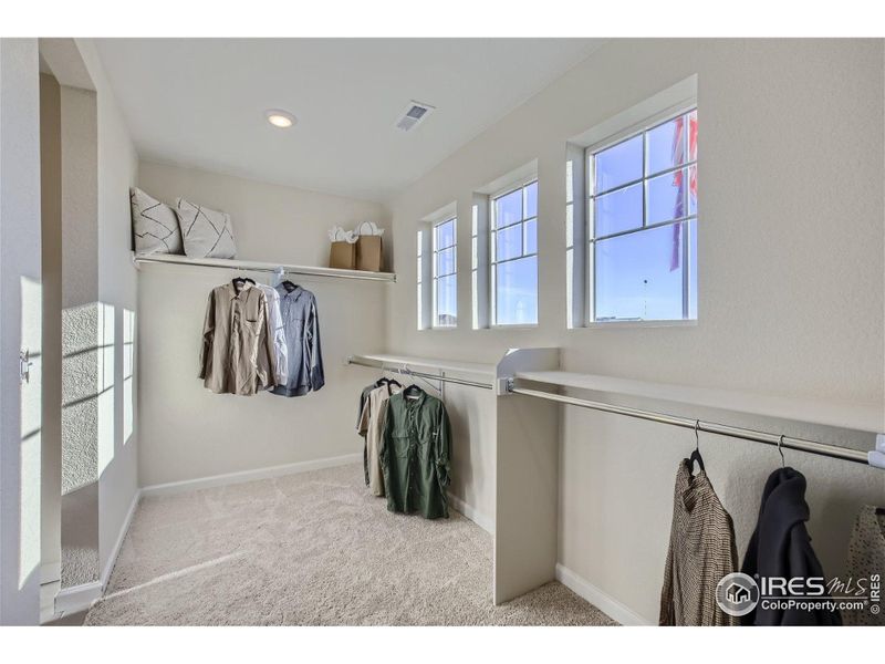Primary Bedroom Walk-In Closet Primary Bedroom Walk-In Closet