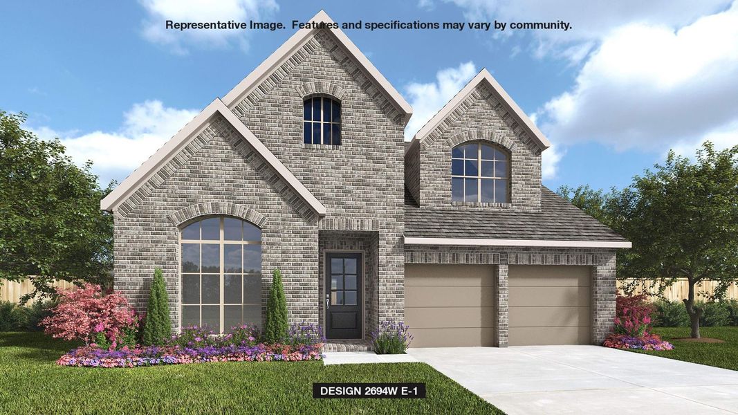 View of front of house with a garage and a front lawn