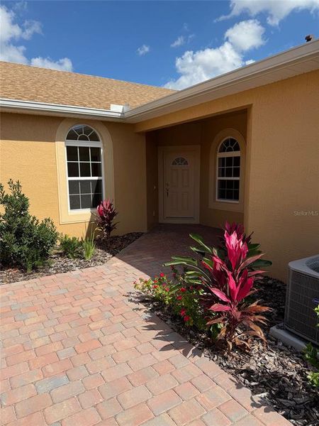 Front exterior of a new home in , Winter Haven, FL, highlighting curb appeal (Image 1).