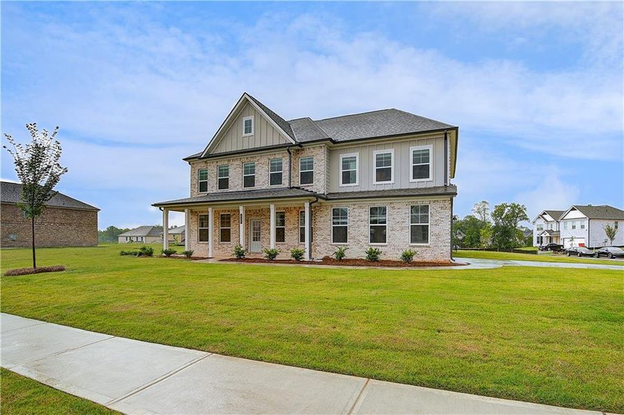 Front exterior of a new home in Westwind Estates, Hampton, GA, highlighting curb appeal (Image 17).