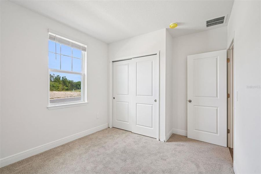 Spacious, unfurnished interior of a new home in The Reserve at Hammock Oaks - Signature Series, Lady Lake (Image 30).