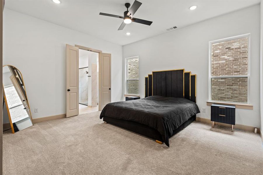 Bedroom featuring carpet floors, recessed lighting, connected bathroom, and a ceiling fan