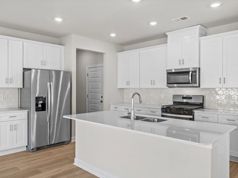 Furnished interior view inside a new home in The Farm at Wells Creek - Signature Collection, Gray Court (Image 4).