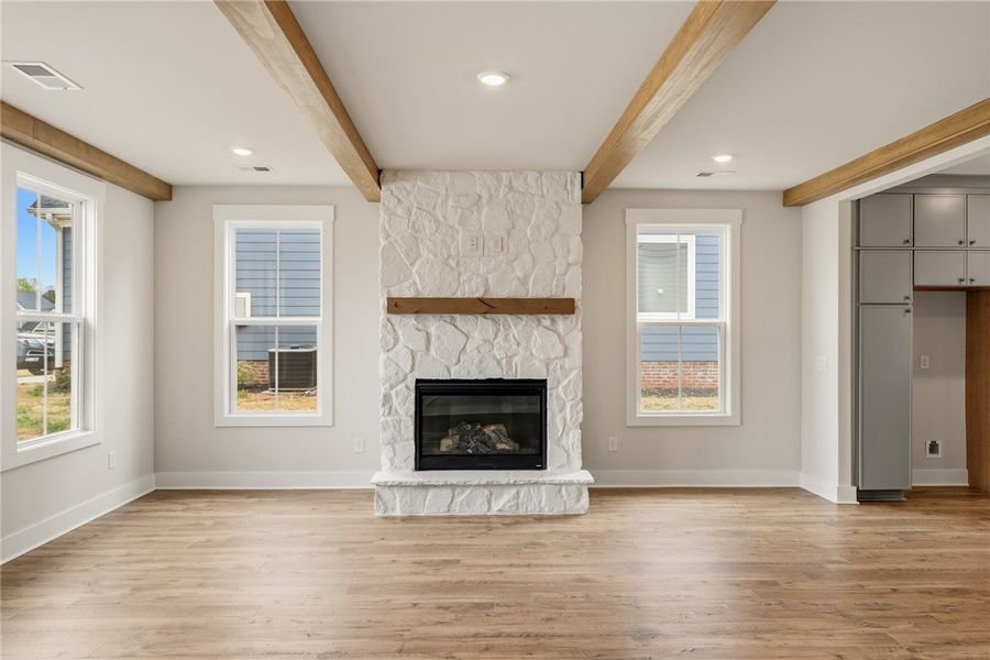 This living room offers a comforting fireplace wit