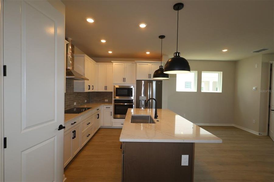 Furnished interior view inside a new home in Weslyn Park in Sunbridge 34', St. Cloud (Image 4).