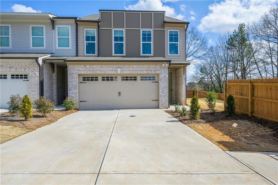 Front exterior of a home in the The Collection at Wolf Creek community, located in Lawrenceville, GA (Image 3).