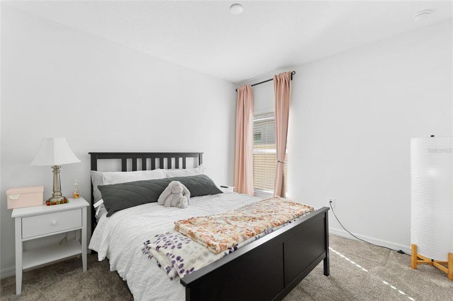 Furnished interior view inside a new home in Lawson Dunes: Estate Collection, Haines City (Image 16).