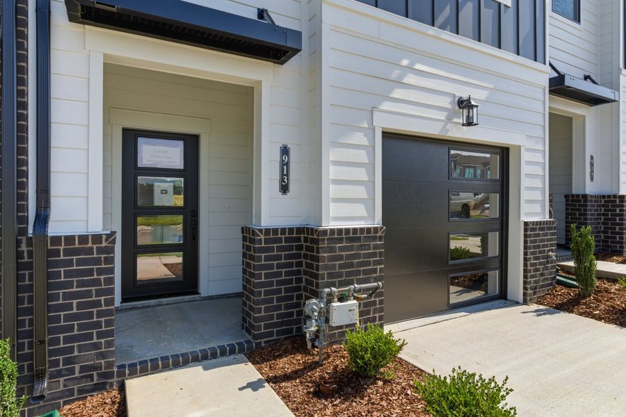 Exterior details and patio area of a home in Nexus Townhomes, Gallatin (Image 21).
