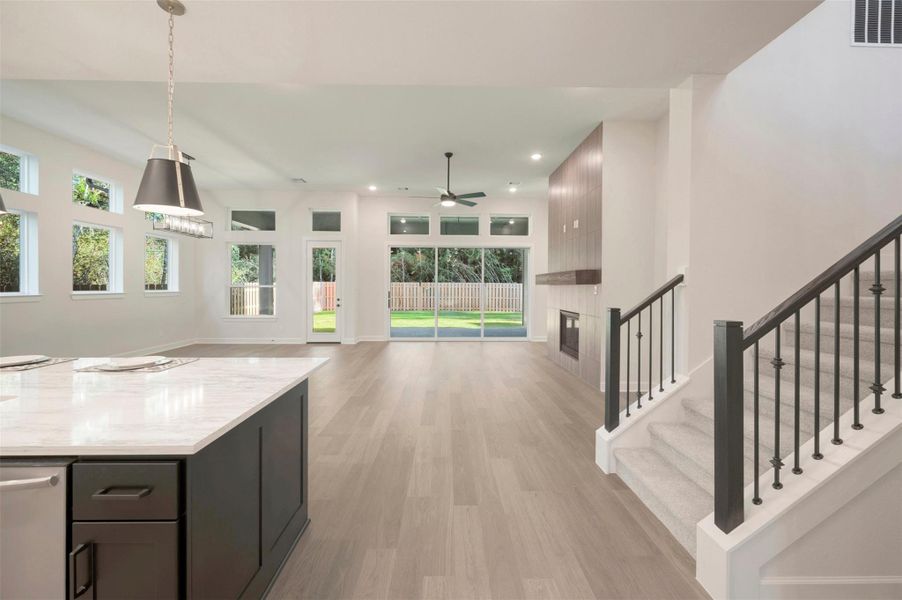 The high ceilings and wall of windows brings the outside in!