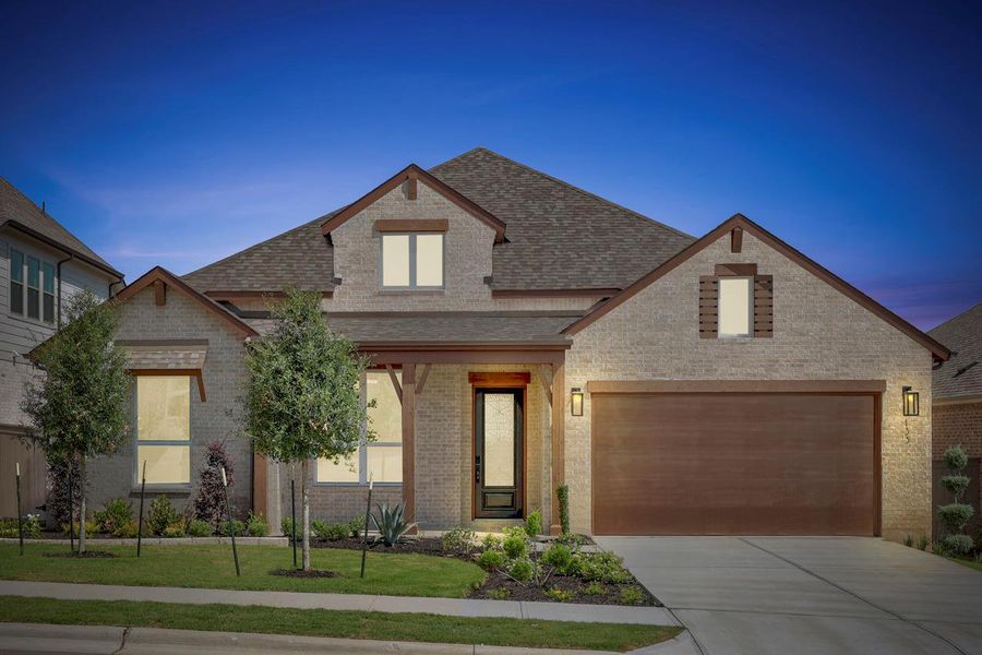 Front exterior of a new home in Flora, Hutto, TX, highlighting curb appeal (Image 2). Front exterior of a new home in Flora, Hutto, TX, highlighting curb appeal (Image 2).