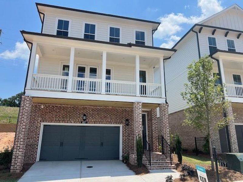 Front exterior of a new home in Palisades Single Family, Cumming, GA, highlighting curb appeal (Image 33).