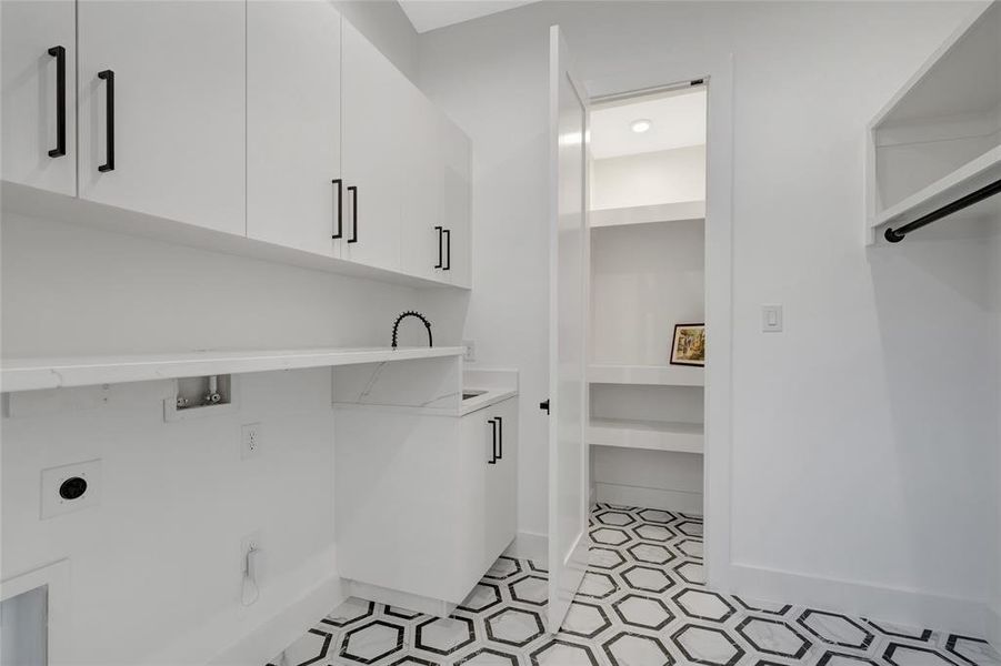 Laundry room with washer/dryer  hookup,and lots of cabinets