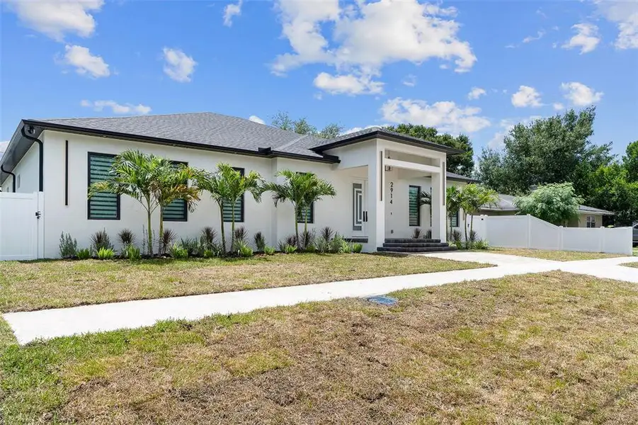 Front exterior of a new home in , Tampa, FL, highlighting curb appeal (Image 1). Front exterior of a new home in , Tampa, FL, highlighting curb appeal (Image 1).