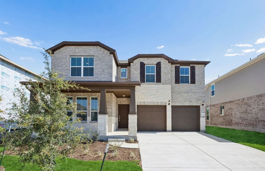 Front exterior of a new home in Lagos, Manor, TX, highlighting curb appeal (Image 19).