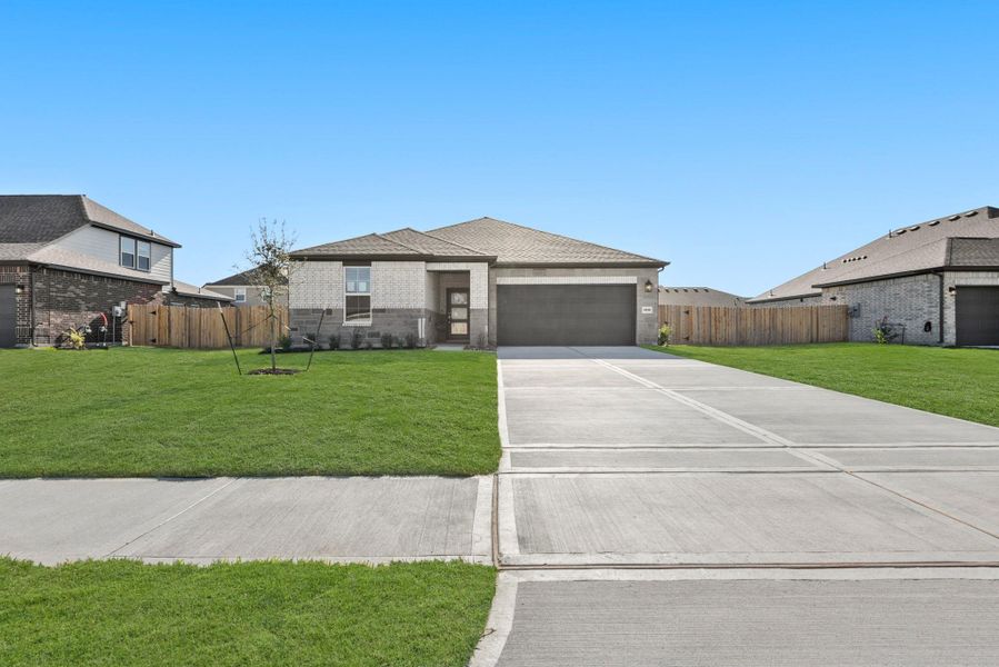 Front exterior of a new home in Country Creek, Mont Belvieu, TX, highlighting curb appeal (Image 16).