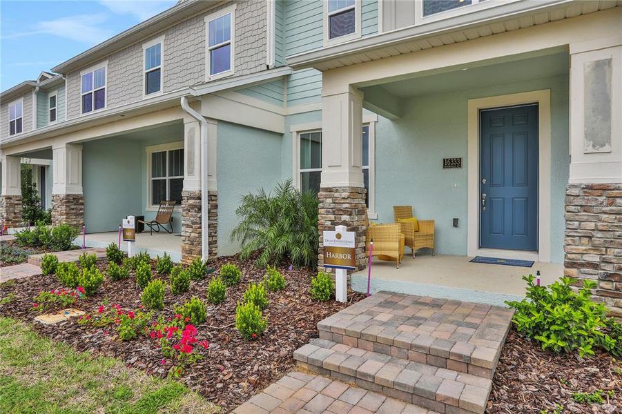 Front exterior of a new home in Hamlin Ridge, Winter Garden, FL, highlighting curb appeal (Image 24).