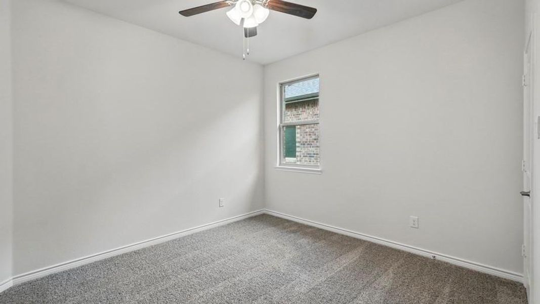 Neutral wall paint and grey carpet flooring