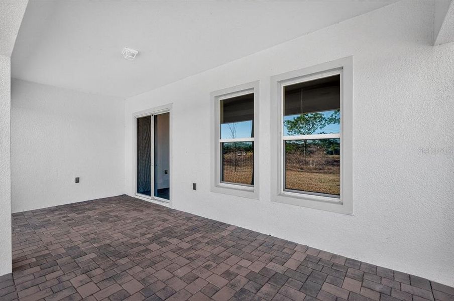 Exterior details and patio area of a home in Gray Hawk at Hole Two, Daytona Beach (Image 29).