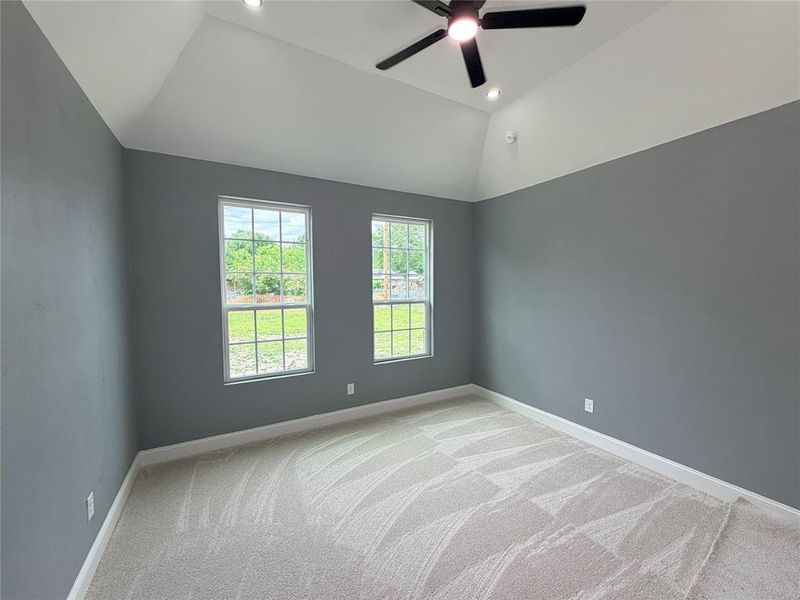 Room featuring a vaulted ceiling with recessed lighting and a ceiling fan Room featuring a vaulted ceiling with recessed lighting and a ceiling fan