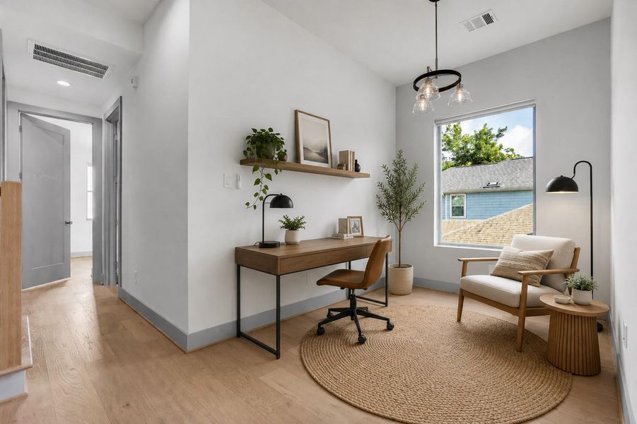 Located on the second floor, this versatile flex room can be customized to suit your needs, whether used as a home office, media room, playroom, or additional living space. (Virtually Staged)
