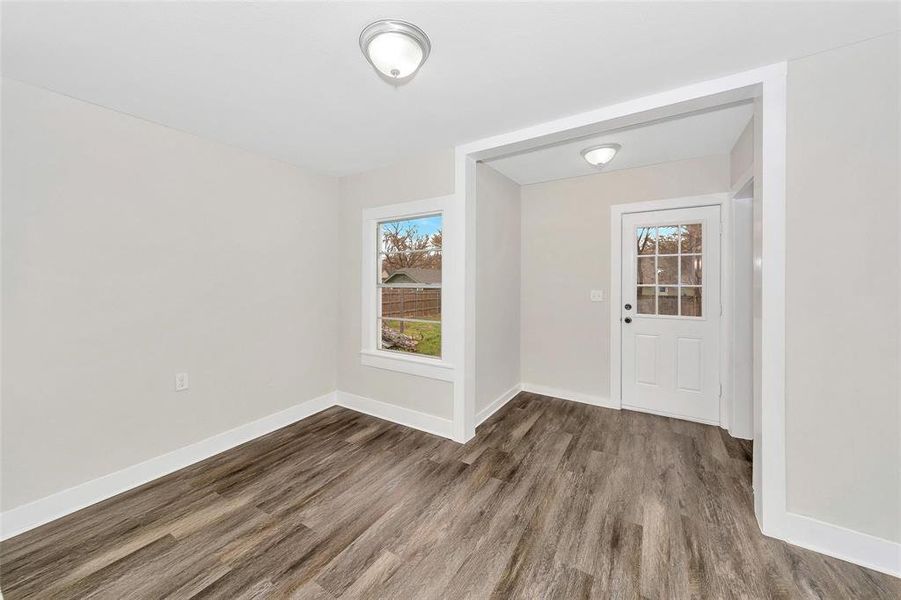 Entryway with wood finished floors and baseboards Entryway with wood finished floors and baseboards