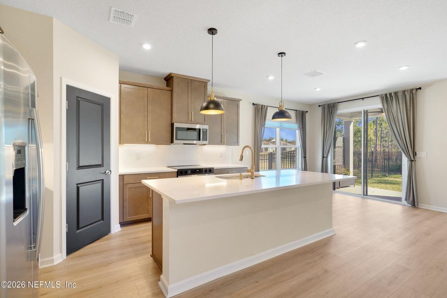 Furnished interior view inside a new home in Seminole Palms Single-Family Homes, Palm Coast (Image 18).