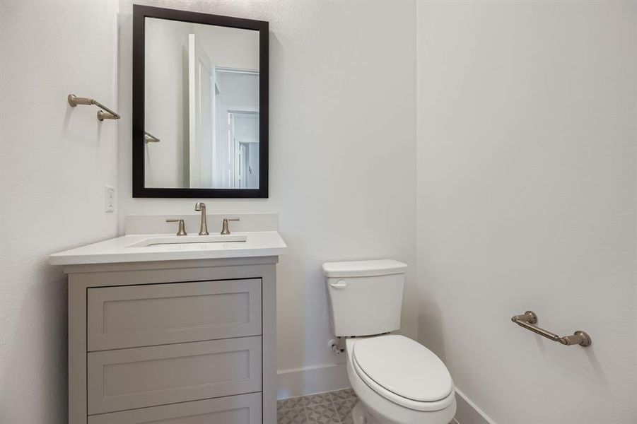 Bathroom featuring toilet and vanity