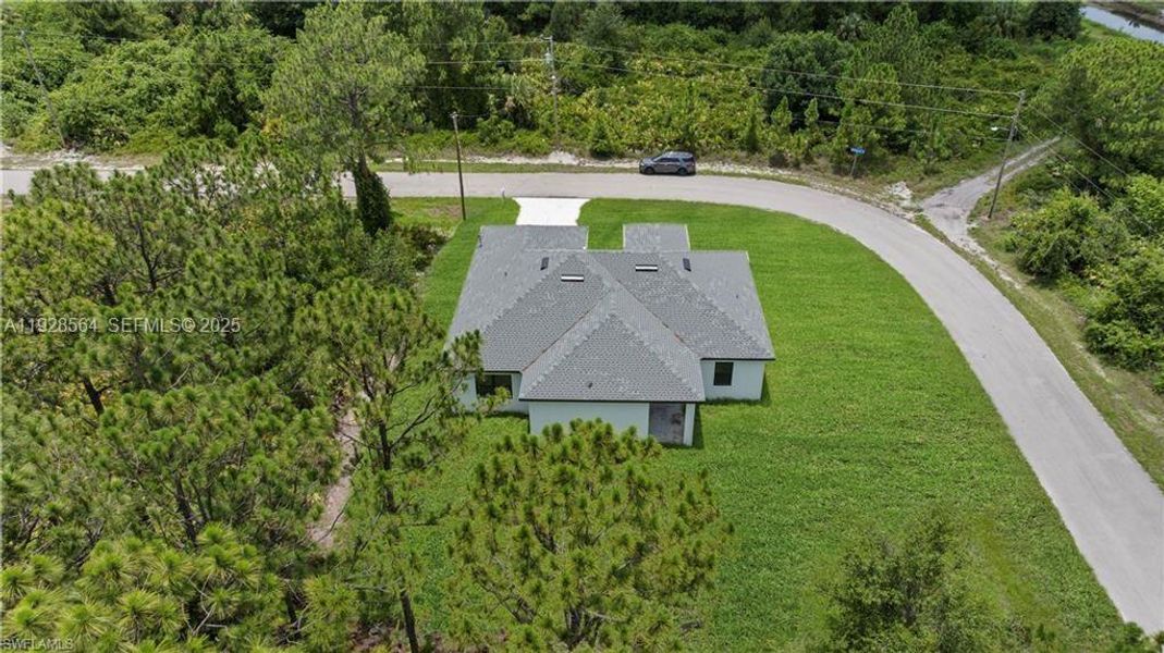 Front exterior of a new home in , Lehigh Acres, FL, highlighting curb appeal (Image 26).