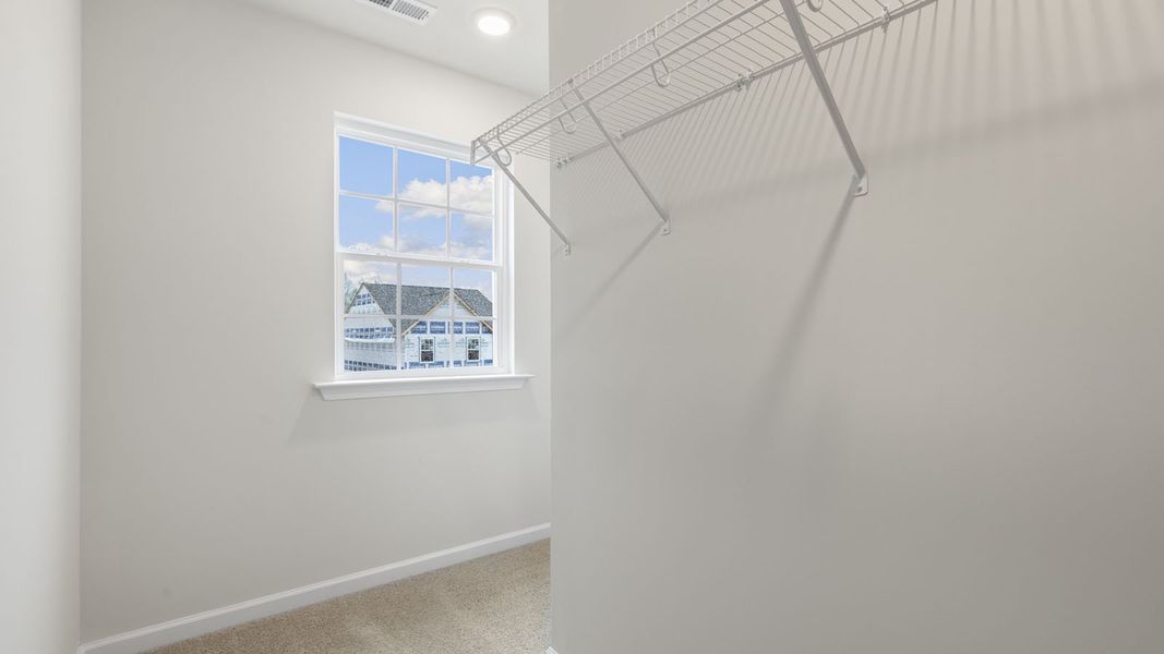 Spacious, unfurnished interior of a new home in The Grove at Matthews Landing, Fuquay Varina (Image 26).