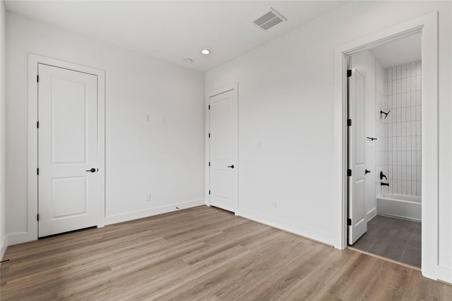 A spacious 12x14 guest bedroom on the 3rd floor, complete with its own ensuite bath and walk-in closet for added comfort and privacy. A spacious 12x14 guest bedroom on the 3rd floor, complete with its own ensuite bath and walk-in closet for added comfort and privacy.