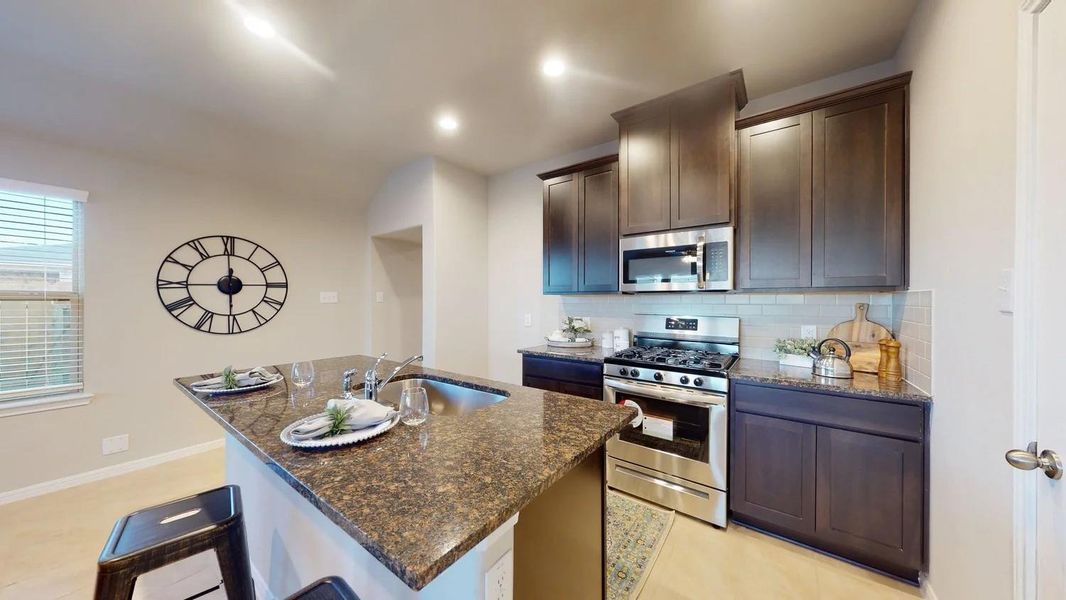 Furnished interior view inside a new home in Sunterra, Katy (Image 19).