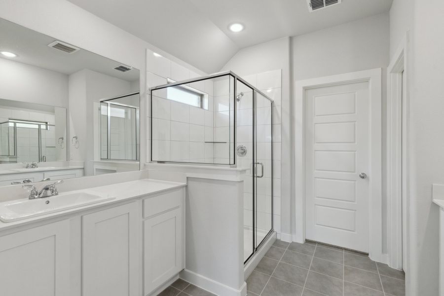 Primary Bathroom in the Harrison home plan by Trophy Signature Homes – REPRESENTATIVE PHOTO