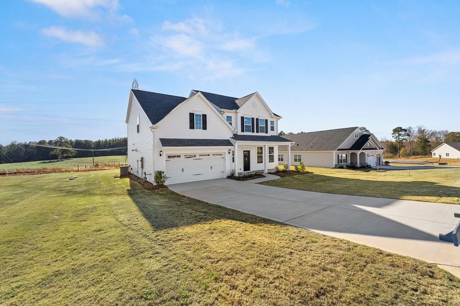 Front exterior of a new home in Foxhall Landing, Easley, SC, highlighting curb appeal (Image 2).