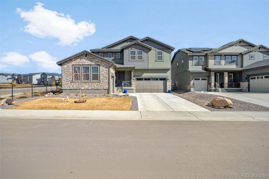 Front exterior of a new home in Red Rocks Ranch, Morrison, CO, highlighting curb appeal (Image 22).